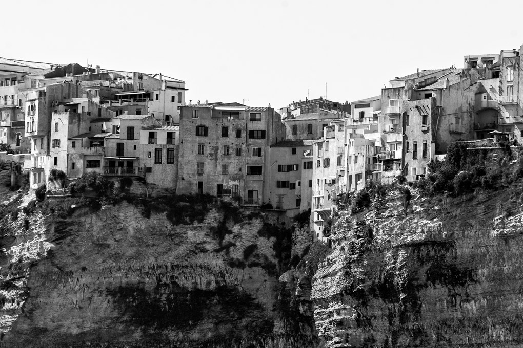 Bonifacio, Corse-du-Sud, Corsica, France, cliffs, homes, houses, black and white, hanging houses, cliff house, old, rocks, formation, architecture, town, urban, landscape