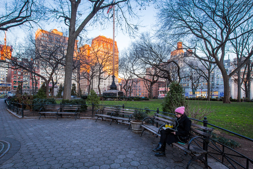 street photography, pink, pink hat, union square, read, book, winter, cold